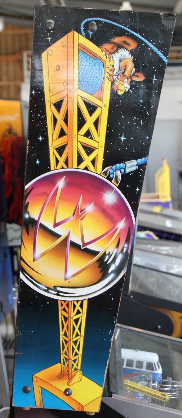 The side of a real backbox, painted with a crane.