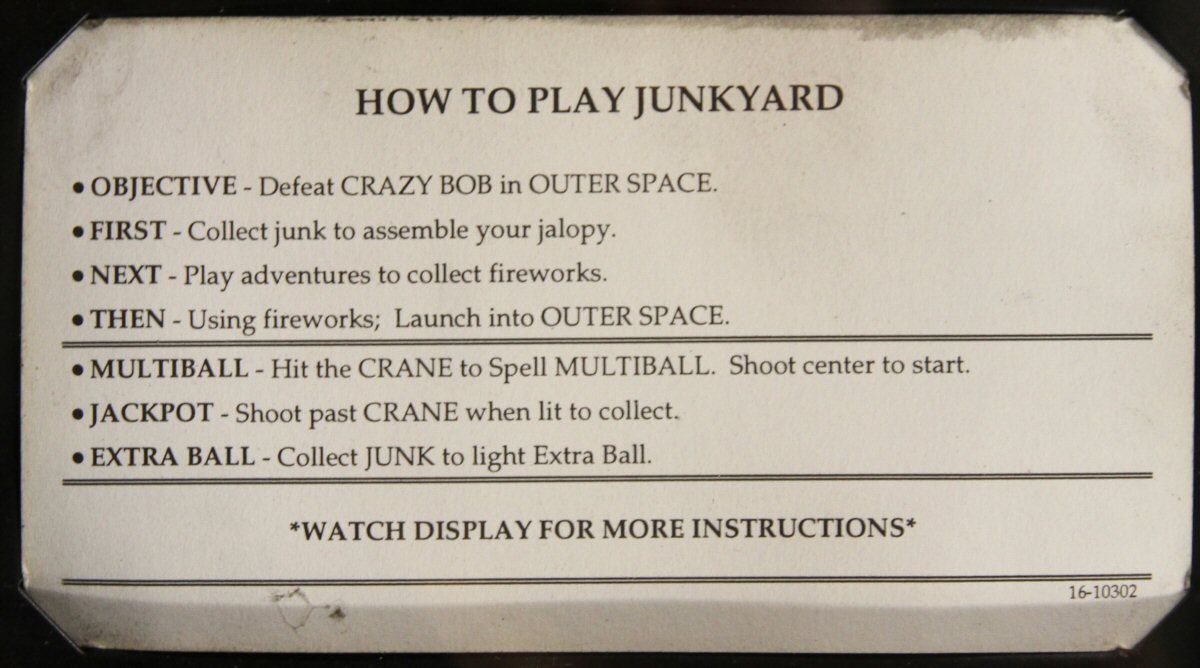 The instruction card from a real apron: how to play Junk Yard.