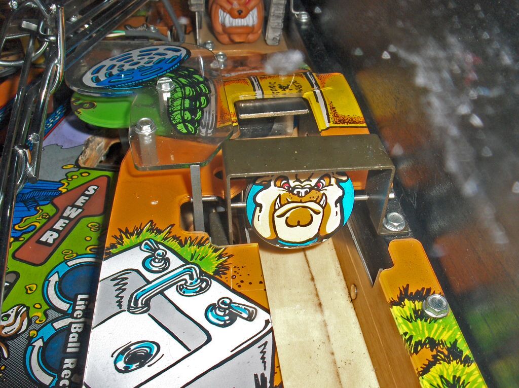 The spinner at the top of a real shooter lane, with Spike's face on it.