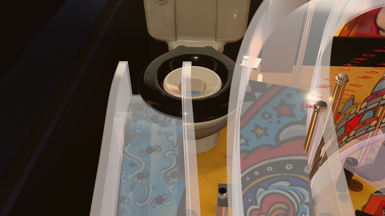 Our cream toilet with its black seat, seen past the clear ramps.